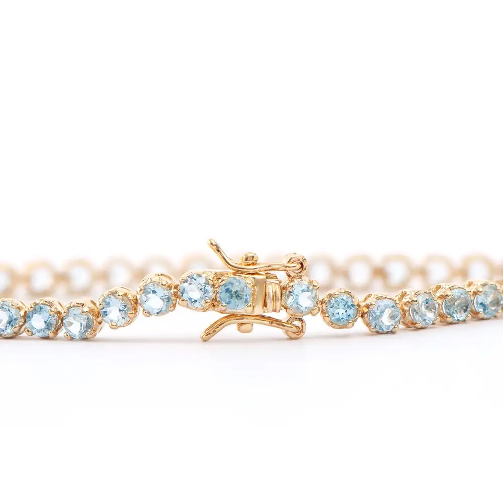 5.15 CTW Blue Topaz 18K Gold Plated Designer Bracelet Size 7.5 Inches | Estimated Retail Value: $1,899 (AMG) at PristineAuction.com 5.15 CTW Blue Topaz 18K Gold Plated Designer Bracelet Size 7.5 Inches | Estimated Retail Value: $1,899 (AMG) at PristineAuction.com