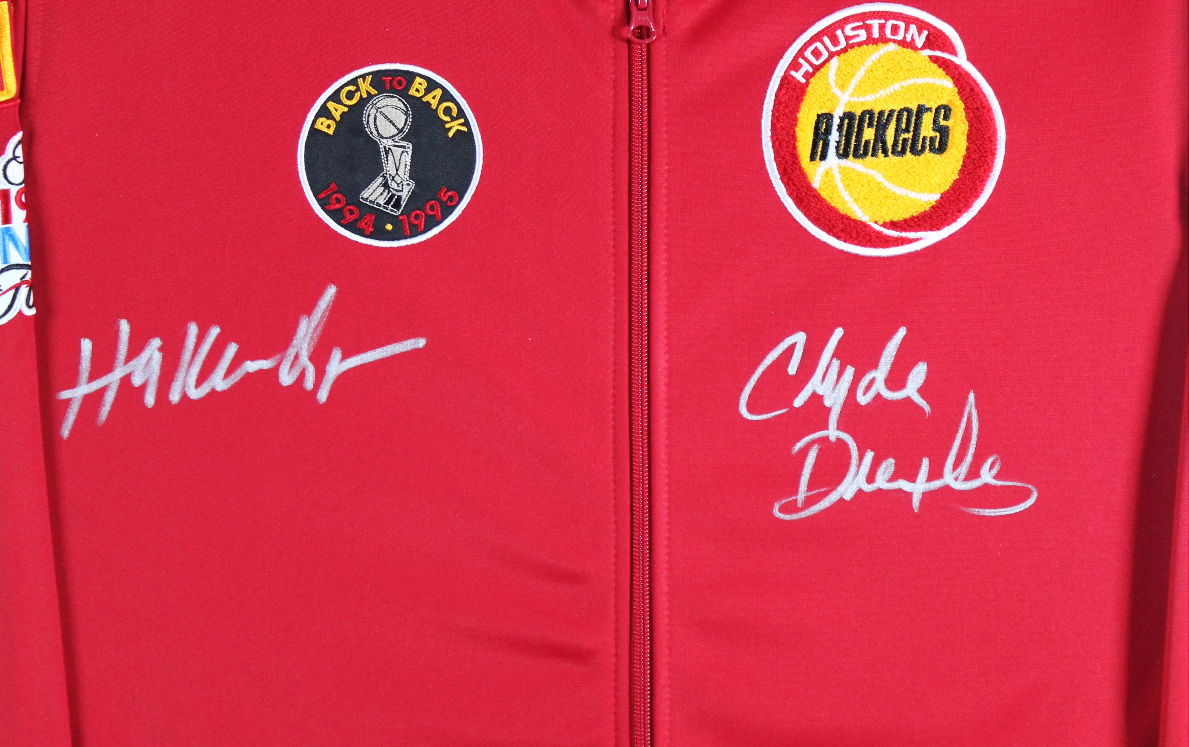 Hakeem Olajuwon & Clyde Drexler Signed Rockets Custom Framed Mitchell & Ness Bomber Jacket (Beckett) at PristineAuction.com Hakeem Olajuwon & Clyde Drexler Signed Rockets Custom Framed Mitchell & Ness Bomber Jacket (Beckett) at PristineAuction.com