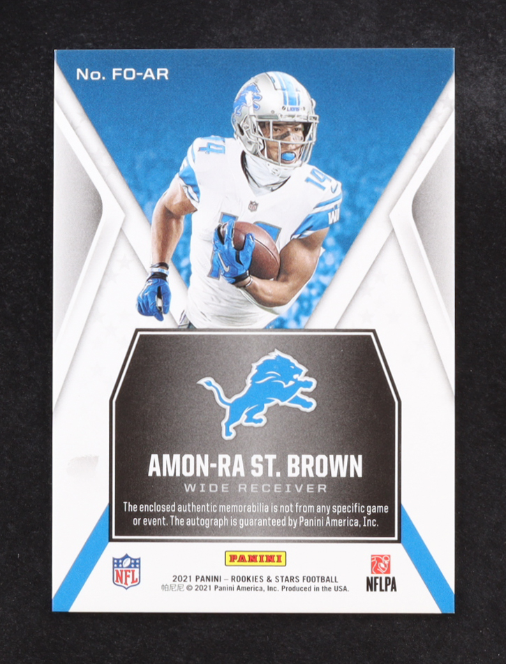 Amon-Ra St. Brown 2021 Rookies and Stars Freshman Orientation Jersey Autographs #28 #32/99 RC at PristineAuction.com Amon-Ra St. Brown 2021 Rookies and Stars Freshman Orientation Jersey Autographs #28 #32/99 RC at PristineAuction.com