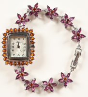New 14 CTW Orange Garnet & Amethyst Quartz Watch | Estimate Retail Value $1,600 (UGL) at PristineAuction.com