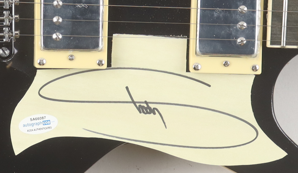 Eminem Electric Guitar with Signed Custom Cut Pickguard (ACOA) at PristineAuction.com Eminem Electric Guitar with Signed Custom Cut Pickguard (ACOA) at PristineAuction.com