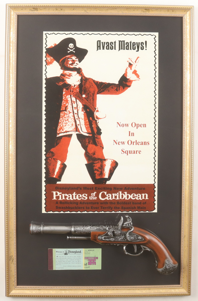 Disney's Disneyland Pirates of the Caribbean Custom Framed Photo Display with A-E Ticket Book & Toy Pistol at PristineAuction.com Disney's Disneyland Pirates of the Caribbean Custom Framed Photo Display with A-E Ticket Book & Toy Pistol at PristineAuction.com