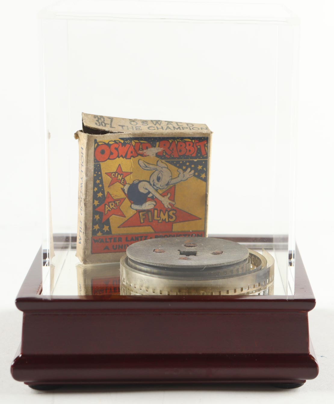 Oswald The Rabbit 1940 Disney Vintage 8MM Film with Original Packaging in Glass Display Case at PristineAuction.com Oswald The Rabbit 1940 Disney Vintage 8MM Film with Original Packaging in Glass Display Case at PristineAuction.com