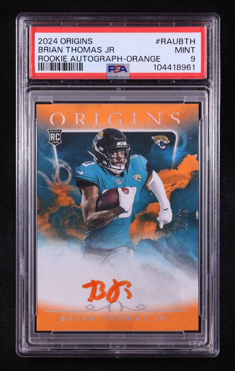 Brian Thomas Jr. 2024 Panini Origins Rookie Autographs Orange #15 RC #22/75 (PSA 9) at PristineAuction.com Brian Thomas Jr. 2024 Panini Origins Rookie Autographs Orange #15 RC #22/75 (PSA 9) at PristineAuction.com