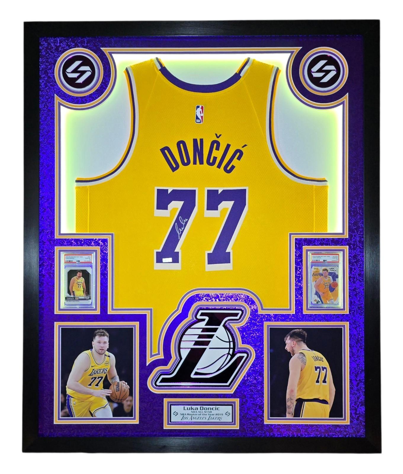 Luka Doncic Signed Lakers Custom Framed Nike Jersey with LED Display & (2) PSA 10 Graded Cards (Panini) at PristineAuction.com Luka Doncic Signed Lakers Custom Framed Nike Jersey with LED Display & (2) PSA 10 Graded Cards (Panini) at PristineAuction.com