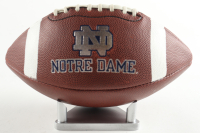 Notre Dame Fighting Irish Logo Silver Stamped Football with Display Stand at PristineAuction.com