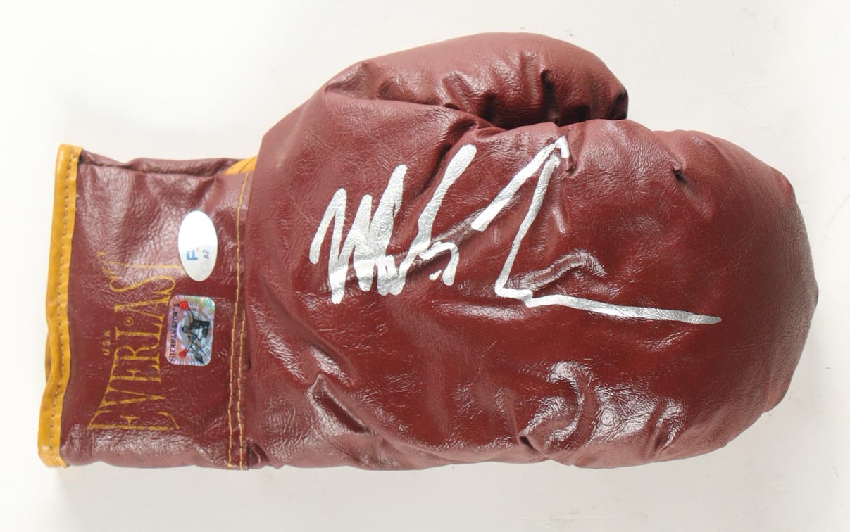 Mike Tyson Signed Vintage Everlast Boxing Glove with Photo-back Wood Display Case (Tyson & PSA) at PristineAuction.com Mike Tyson Signed Vintage Everlast Boxing Glove with Photo-back Wood Display Case (Tyson & PSA) at PristineAuction.com