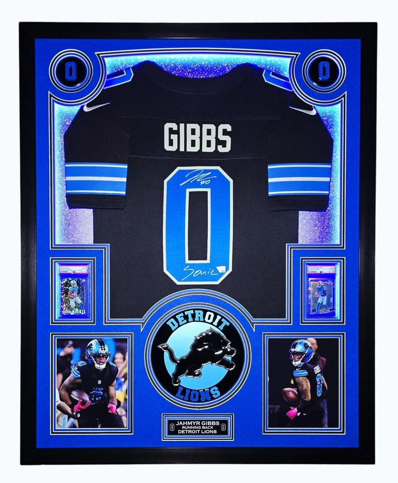 Jahmyr Gibbs Signed Lions Custom Framed Nike Jersey Inscribed "Sonic" with LED Display & (2) PSA 10 Graded Rookie Cards (Fanatics) at PristineAuction.com Jahmyr Gibbs Signed Lions Custom Framed Nike Jersey Inscribed "Sonic" with LED Display & (2) PSA 10 Graded Rookie Cards (Fanatics) at PristineAuction.com