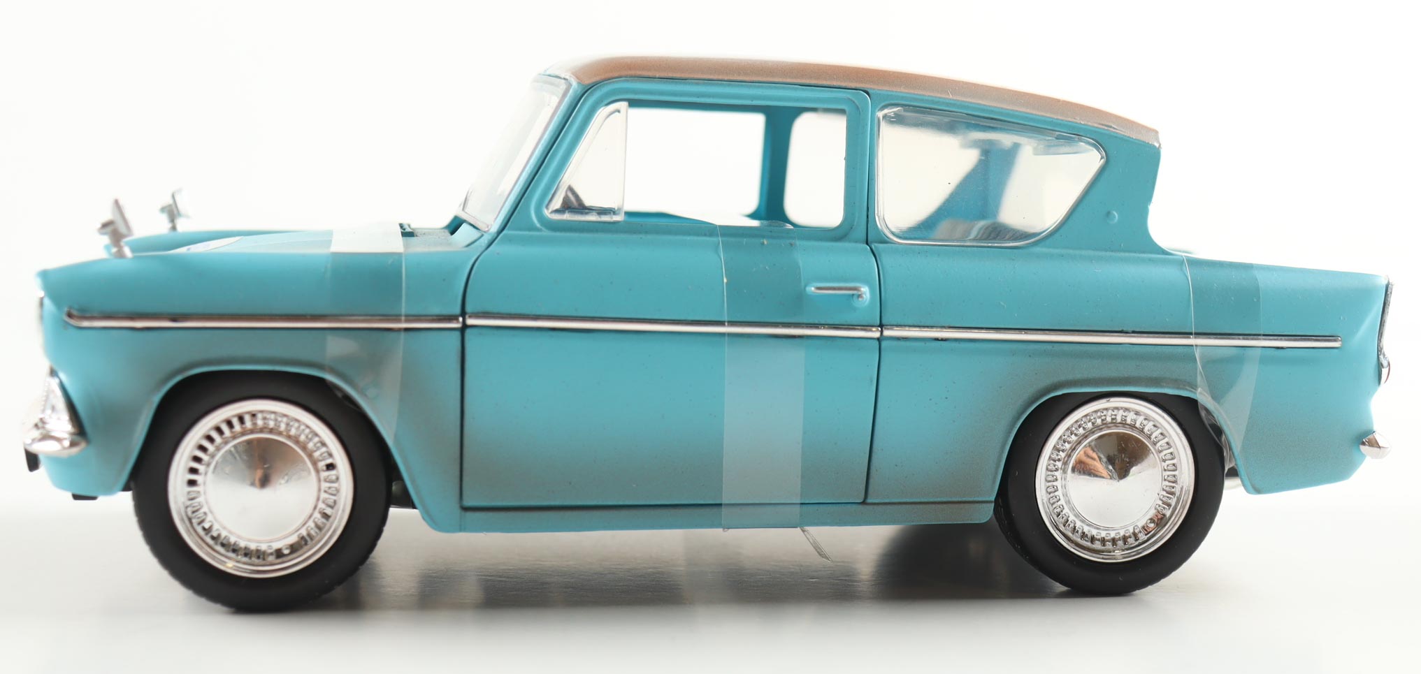 Daniel Radcliffe Signed Harry Potter 1:24 Die-Cast 1959 Ford Anglia With Harry Potter Figurine (AutographCOA) at PristineAuction.com Daniel Radcliffe Signed Harry Potter 1:24 Die-Cast 1959 Ford Anglia With Harry Potter Figurine (AutographCOA) at PristineAuction.com