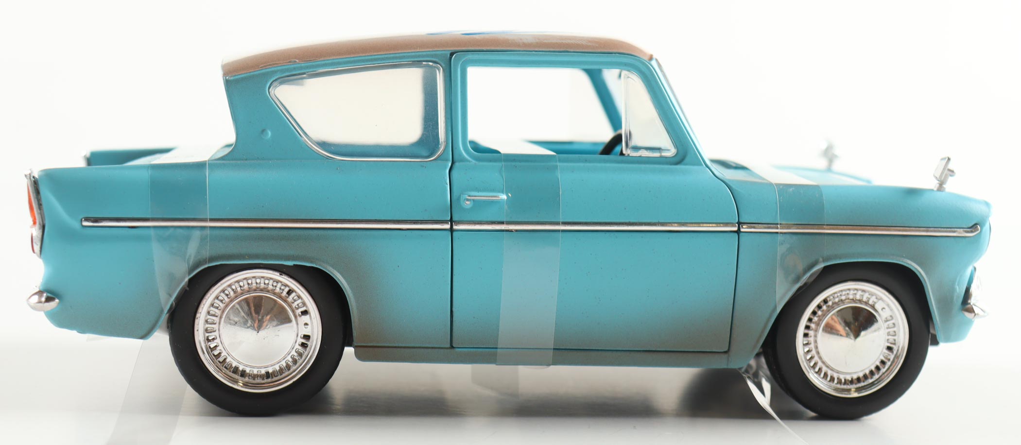 Daniel Radcliffe Signed Harry Potter 1:24 Die-Cast 1959 Ford Anglia With Harry Potter Figurine (AutographCOA) at PristineAuction.com Daniel Radcliffe Signed Harry Potter 1:24 Die-Cast 1959 Ford Anglia With Harry Potter Figurine (AutographCOA) at PristineAuction.com