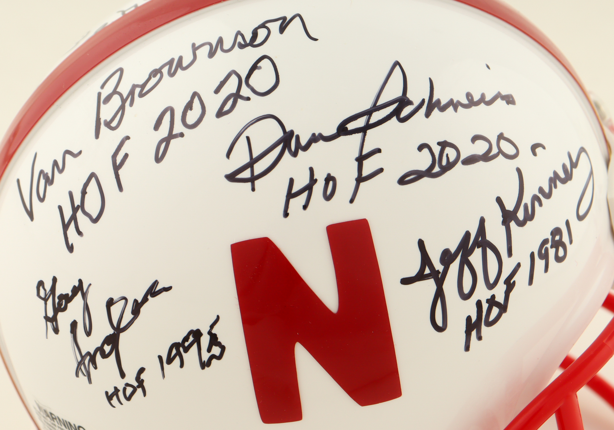 Nebraska Cornhuskers Mini Helmet Signed By (8) With Van Brownson, Dan Schneiss, Guy Ingles, Jeff Kinney With Multiple Hall Of Fame Inscriptions (AIV) at PristineAuction.com Nebraska Cornhuskers Mini Helmet Signed By (8) With Van Brownson, Dan Schneiss, Guy Ingles, Jeff Kinney With Multiple Hall Of Fame Inscriptions (AIV) at PristineAuction.com