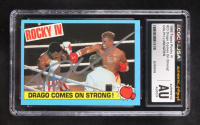 Dolph Lundgren 1985 Topps Rocky IV Drago Comes On Strong! #23 (CGC | Autograph Graded CGC 9) at PristineAuction.com