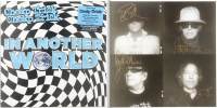 Cheap Trick Band-Signed 12x12 Album Insert with Factory Sealed "In Another World" Record Album (JSA) at PristineAuction.com