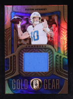 Justin Herbert 2022 Panini Gold Standard Football Gold Gear #GG-JHE #178/299 at PristineAuction.com