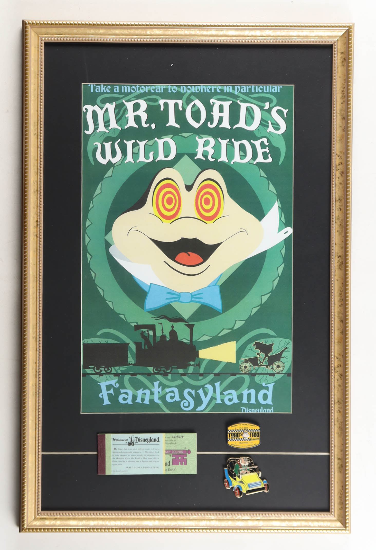 Disneyland "Mr. Toad's Wild Ride" Fantasyland Custom Framed Poster Print Display with (2) Official Ride Pin & Disneyland Ticket Book at PristineAuction.com Disneyland "Mr. Toad's Wild Ride" Fantasyland Custom Framed Poster Print Display with (2) Official Ride Pin & Disneyland Ticket Book at PristineAuction.com