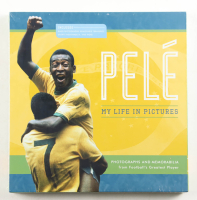 Pele Photograph & Memorabilia Book at PristineAuction.com