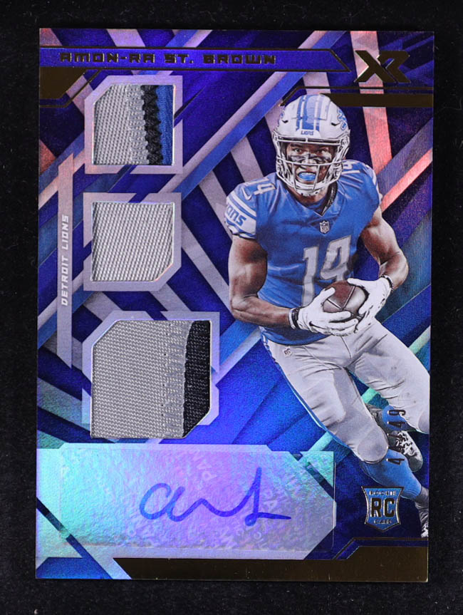 Amon-Ra St. Brown 2021 Panini XR Blue #231 Jersey Autograph #44/49 RC at PristineAuction.com Amon-Ra St. Brown 2021 Panini XR Blue #231 Jersey Autograph #44/49 RC at PristineAuction.com