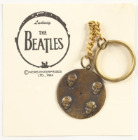 1964 The Beatles Vintage Brass Nems Keychain with Original Packaging at PristineAuction.com