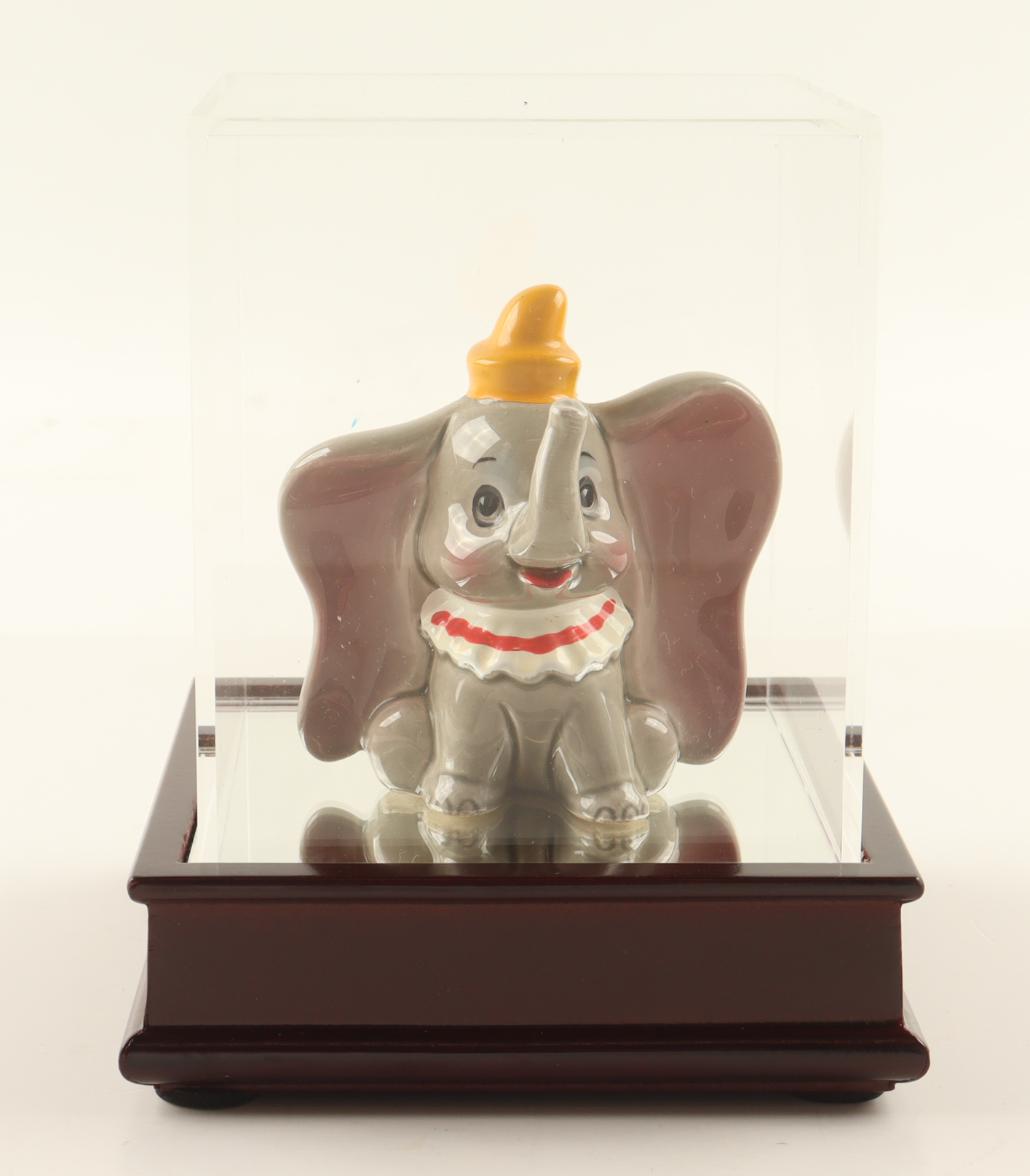 Walt Disney's Dumbo the Flying Elephant Ceramic Figurine with Display Case at PristineAuction.com Walt Disney's Dumbo the Flying Elephant Ceramic Figurine with Display Case at PristineAuction.com