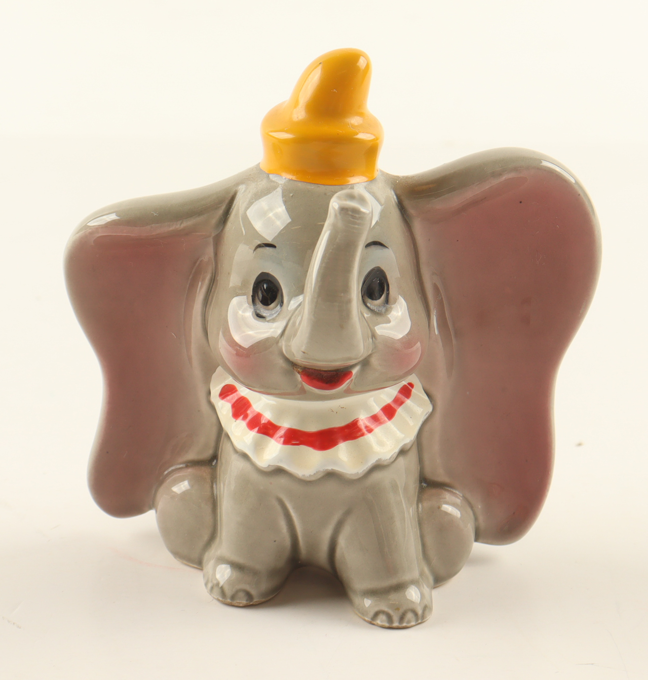 Walt Disney's Dumbo the Flying Elephant Ceramic Figurine with Display Case at PristineAuction.com Walt Disney's Dumbo the Flying Elephant Ceramic Figurine with Display Case at PristineAuction.com