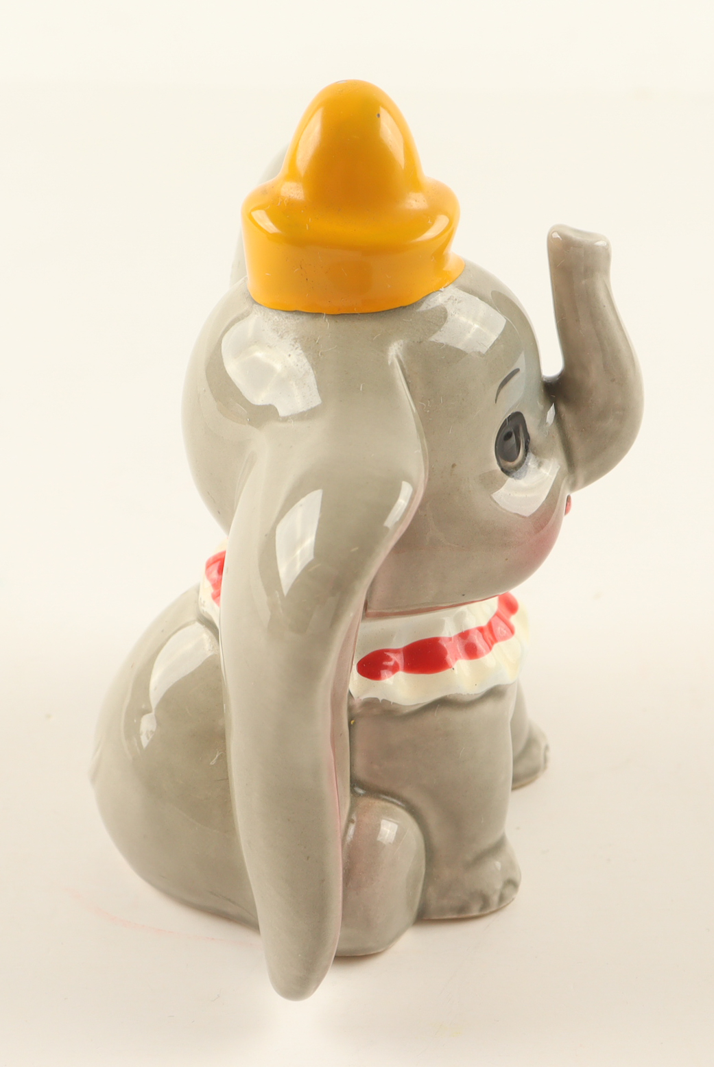 Walt Disney's Dumbo the Flying Elephant Ceramic Figurine with Display Case at PristineAuction.com Walt Disney's Dumbo the Flying Elephant Ceramic Figurine with Display Case at PristineAuction.com