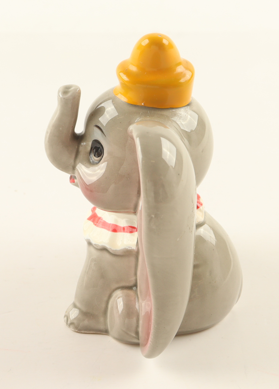 Walt Disney's Dumbo the Flying Elephant Ceramic Figurine with Display Case at PristineAuction.com Walt Disney's Dumbo the Flying Elephant Ceramic Figurine with Display Case at PristineAuction.com