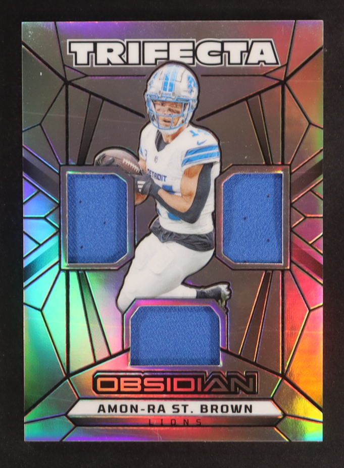 Amon-Ra St. Brown 2024 Panini Obsidian Trifecta Swatches Silver #33 #81/99 at PristineAuction.com Amon-Ra St. Brown 2024 Panini Obsidian Trifecta Swatches Silver #33 #81/99 at PristineAuction.com