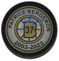 Patrice Bergeron Signed Jersey Number Commemorative Hockey Puck (Bergeron) at PristineAuction.com