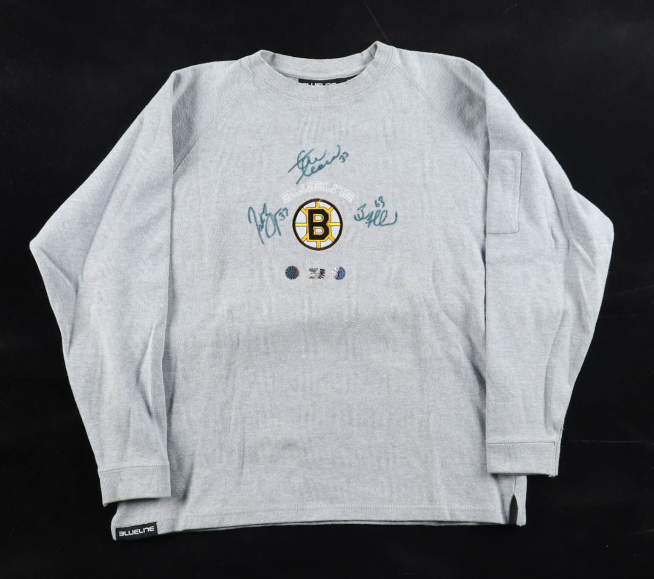 Patrice Bergeron, Zdeno Chára & Brad Marchand Signed Bruins Logo Sweatshirt (Bergeron, Chara, & Marchand) at PristineAuction.com Patrice Bergeron, Zdeno Chára & Brad Marchand Signed Bruins Logo Sweatshirt (Bergeron, Chara, & Marchand) at PristineAuction.com