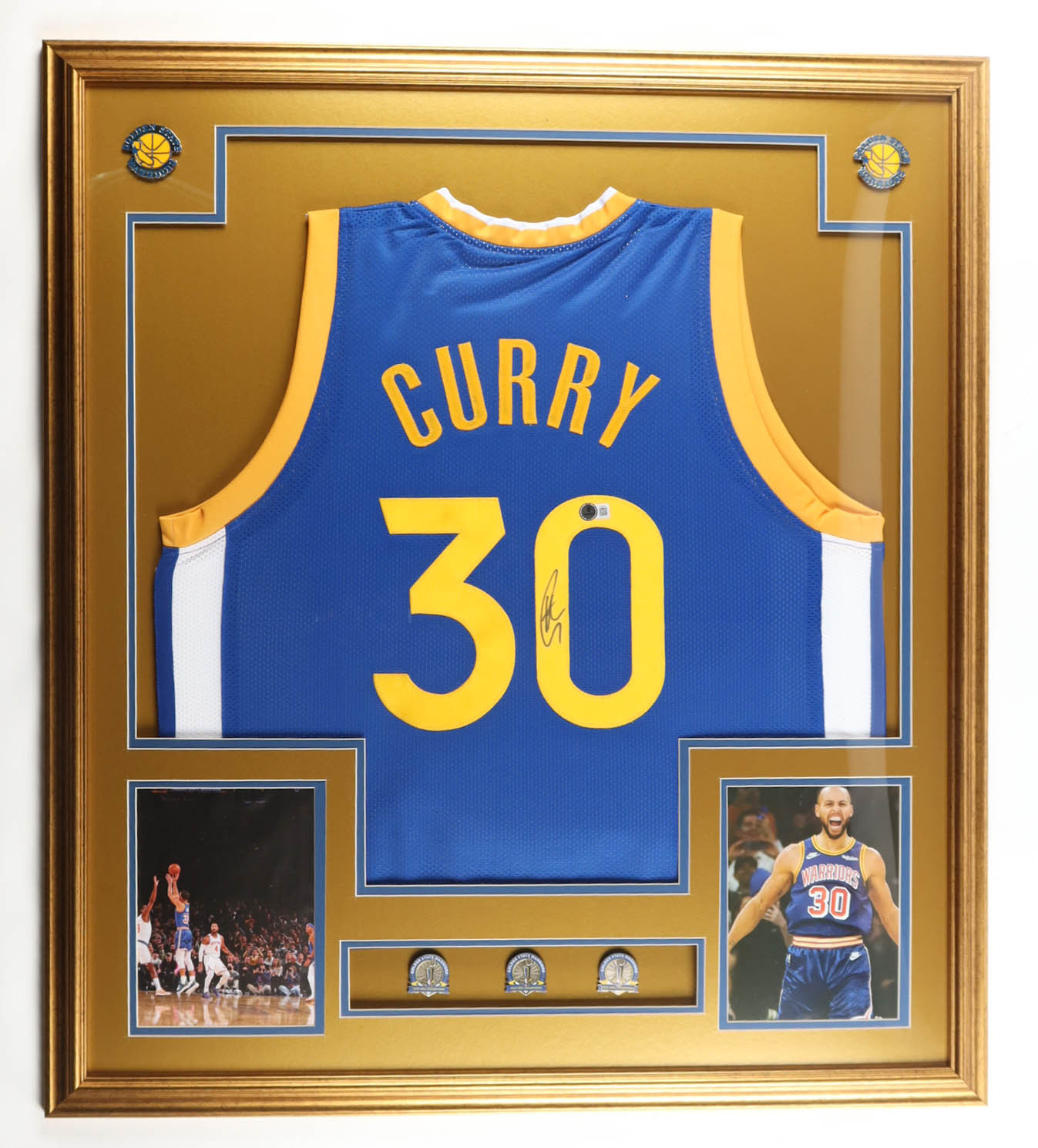 Stephen Curry Signed Custom Framed Jersey Display with (3) Finals Pin & (2) Metal Team Logo Emblems (Beckett) at PristineAuction.com Stephen Curry Signed Custom Framed Jersey Display with (3) Finals Pin & (2) Metal Team Logo Emblems (Beckett) at PristineAuction.com