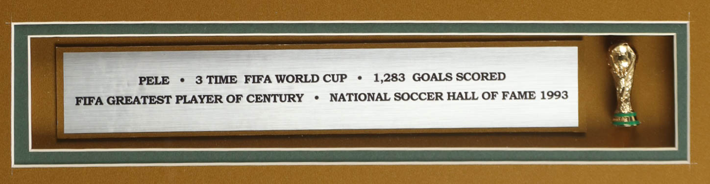 Pele Signed Custom Framed Jersey Display with Stat Plaque & Mini World Cup Trophy (PSA) at PristineAuction.com Pele Signed Custom Framed Jersey Display with Stat Plaque & Mini World Cup Trophy (PSA) at PristineAuction.com