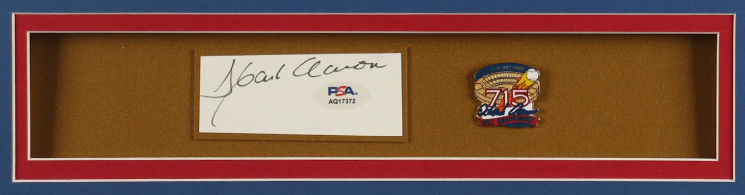 Hank Aaron Signed Custom Framed Cut Display with Jersey & 1974 715 HR Pin (PSA) at PristineAuction.com Hank Aaron Signed Custom Framed Cut Display with Jersey & 1974 715 HR Pin (PSA) at PristineAuction.com