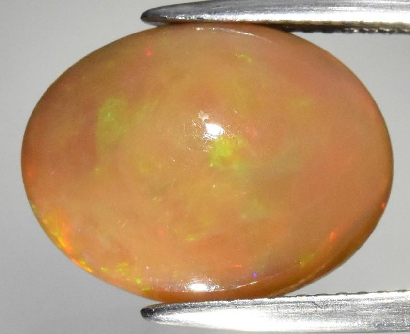 6.28 Carats Natural Yellow Opal Loose (IGI Cert) at PristineAuction.com 6.28 Carats Natural Yellow Opal Loose (IGI Cert) at PristineAuction.com