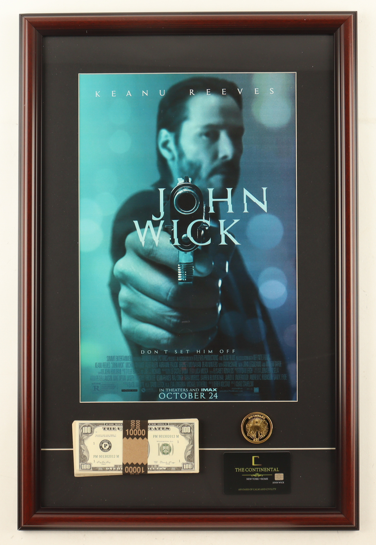 "John Wick" Custom Framed Movie Poster Display with Continental Hotel Key Card, Gold Coin & Prop Money Stack at PristineAuction.com "John Wick" Custom Framed Movie Poster Display with Continental Hotel Key Card, Gold Coin & Prop Money Stack at PristineAuction.com