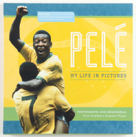 Pele Photograph & Memorabilia Book at PristineAuction.com