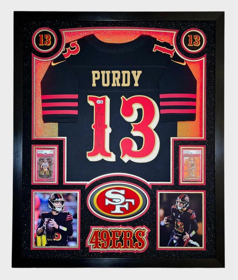 Brock Purdy Signed 49ers Custom Framed Nike Jersey with LED Display & (2) PSA 10 Graded Rookie Cards (Beckett) at PristineAuction.com Brock Purdy Signed 49ers Custom Framed Nike Jersey with LED Display & (2) PSA 10 Graded Rookie Cards (Beckett) at PristineAuction.com