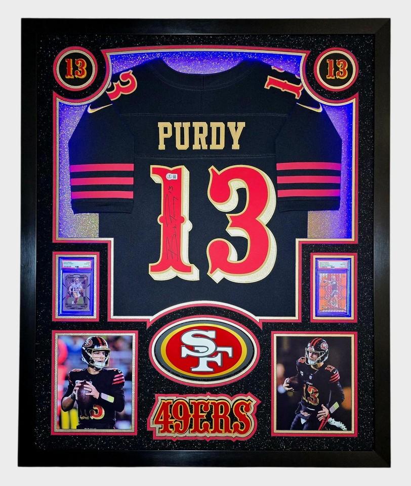 Brock Purdy Signed 49ers Custom Framed Nike Jersey with LED Display & (2) PSA 10 Graded Rookie Cards (Beckett) at PristineAuction.com Brock Purdy Signed 49ers Custom Framed Nike Jersey with LED Display & (2) PSA 10 Graded Rookie Cards (Beckett) at PristineAuction.com