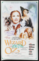 "The Wizard of Oz" 16x24 Poster Cast-Signed by (4) with Mickey Carroll, Jerry Maren, Karl Slover, & Donna Stewart Hardway Inscribed "Munchkin", "1st Trumpeter", & "Lollipop Kid" (JSA) at PristineAuction.com