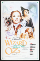 "The Wizard of Oz" 16x24 Poster Cast-Signed by (4) with Mickey Carroll, Jerry Maren, Karl Slover, & Donna Stewart Hardway Inscribed "Munchkin", "1st Trumpeter", & "Lollipop Kid" (JSA) at PristineAuction.com