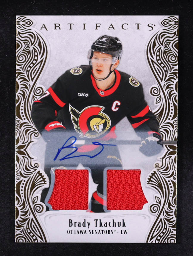 Brady Tkachuk 2025-26 Artifacts Material Autographs Gold #126 # 17/45 at PristineAuction.com Brady Tkachuk 2025-26 Artifacts Material Autographs Gold #126 # 17/45 at PristineAuction.com