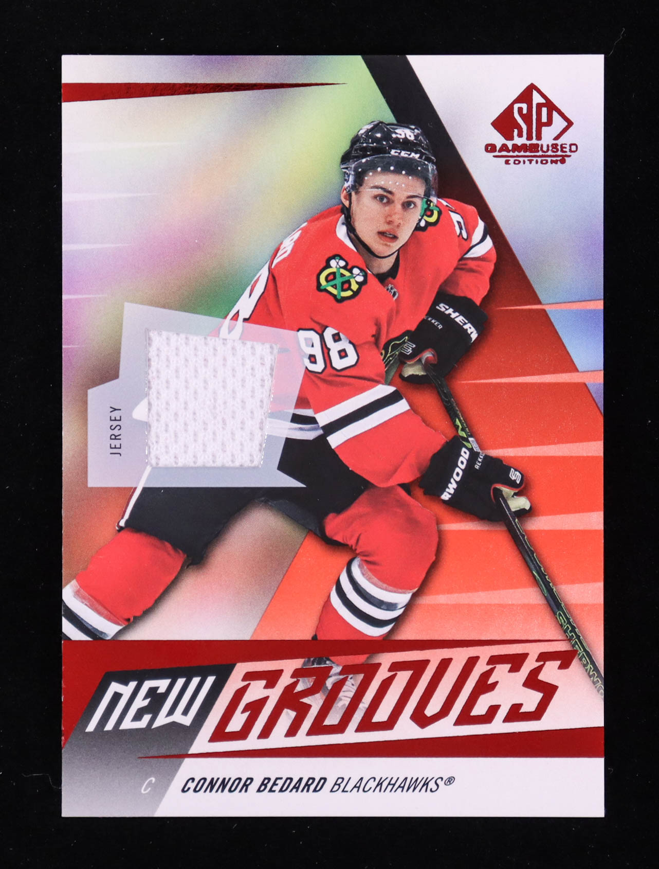 Connor Bedard 2023-24 SP Game Used New Grooves Jerseys #NG16 RC at PristineAuction.com Connor Bedard 2023-24 SP Game Used New Grooves Jerseys #NG16 RC at PristineAuction.com
