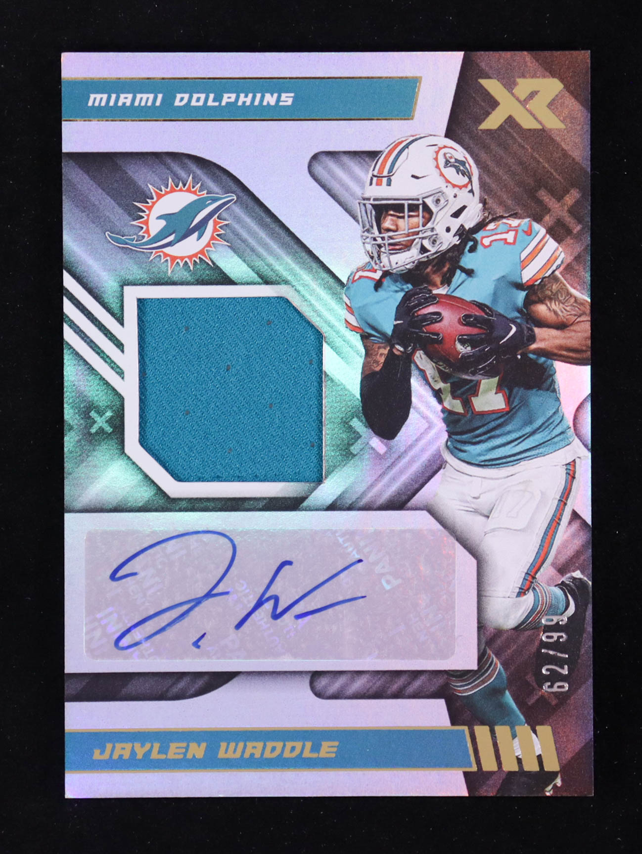 Jaylen Waddle 2022 Panini XR Autograph Swatches #22 #62/99 at PristineAuction.com Jaylen Waddle 2022 Panini XR Autograph Swatches #22 #62/99 at PristineAuction.com