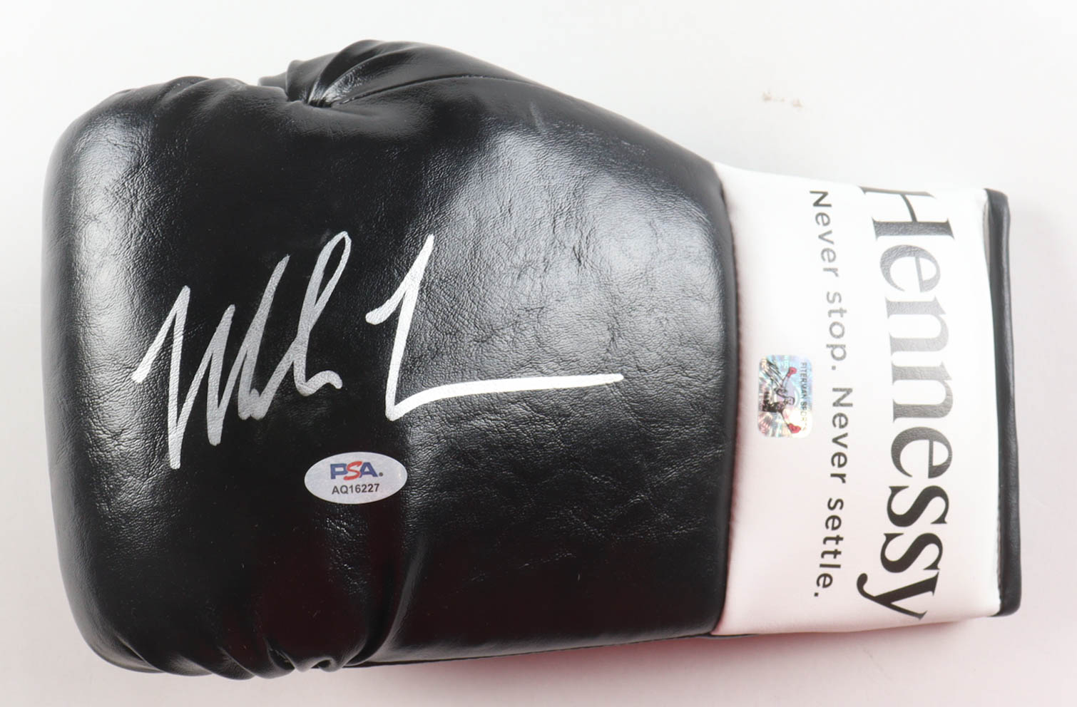 Mike Tyson Signed Hennessy Boxing Glove With Display Stand (PSA & Tyson) at PristineAuction.com Mike Tyson Signed Hennessy Boxing Glove With Display Stand (PSA & Tyson) at PristineAuction.com