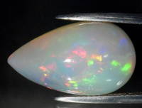 13.71 Carats Natural White Opal Loose | Estimated Retail Value: $3,200 (UGL Cert) at PristineAuction.com