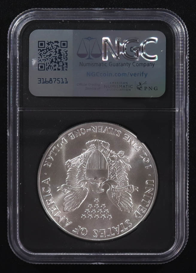 Mint Error 1986-(S) American Silver Eagle $1 Coin Struck at San Francisco Obverse Struck Thru - Anna Escobedo Cabral Signed Label (NGC MS69) at PristineAuction.com Mint Error 1986-(S) American Silver Eagle $1 Coin Struck at San Francisco Obverse Struck Thru - Anna Escobedo Cabral Signed Label (NGC MS69) at PristineAuction.com