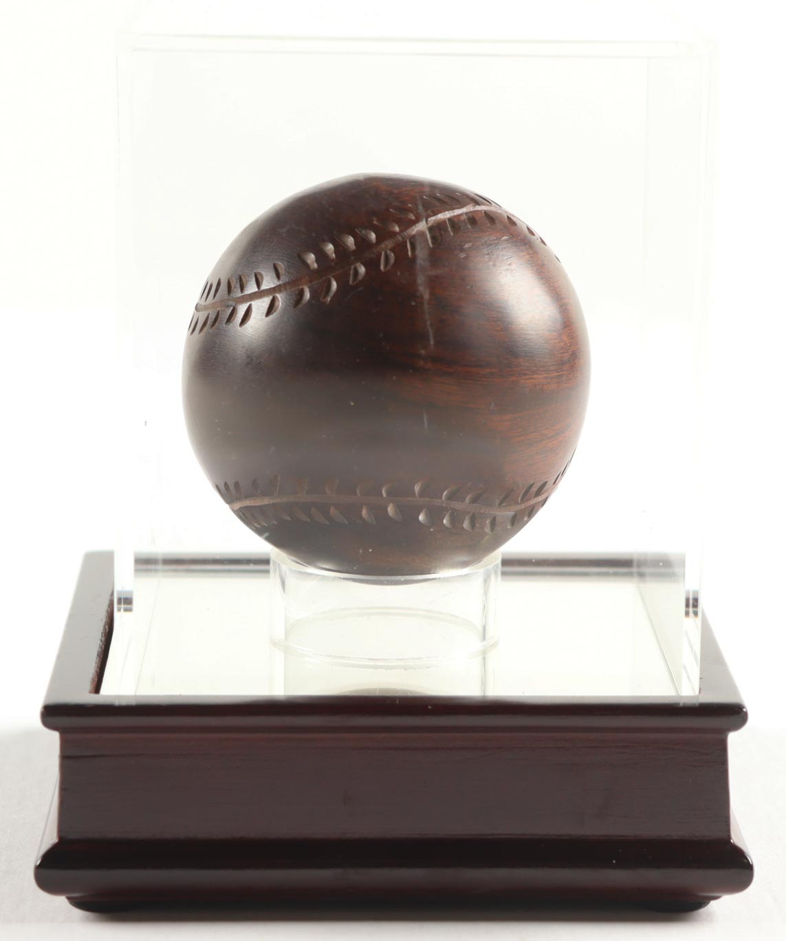 Carved Wooden Baseball with Display Case at PristineAuction.com Carved Wooden Baseball with Display Case at PristineAuction.com