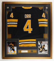 Bobby Orr Signed Custom Framed Cut Display With Jersey, Stanley Cup Champions Pin & (2) Team Logo Patches (PSA) at PristineAuction.com