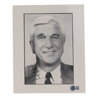 Leslie Nielsen Signed 8x10 Photo Inscribed "Luck + Laughs" (Beckett) at PristineAuction.com