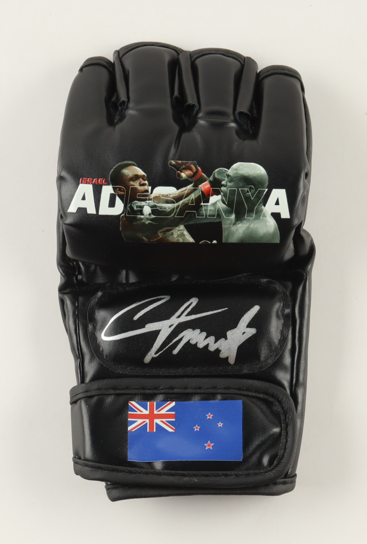 Israel Adesanya Signed Custom New Zealand MMA Fight Glove (Beckett) at PristineAuction.com Israel Adesanya Signed Custom New Zealand MMA Fight Glove (Beckett) at PristineAuction.com
