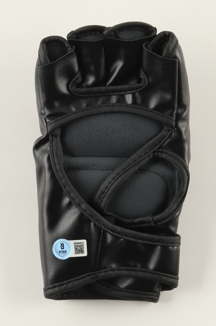 Israel Adesanya Signed Custom New Zealand MMA Fight Glove (Beckett) at PristineAuction.com Israel Adesanya Signed Custom New Zealand MMA Fight Glove (Beckett) at PristineAuction.com